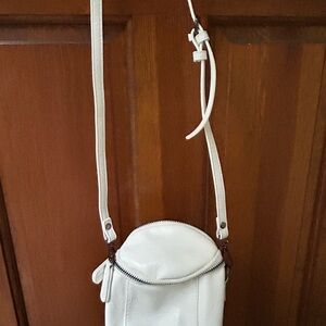Stylish White Crossbody Bag with Flap Closure and Adjustable Strap
